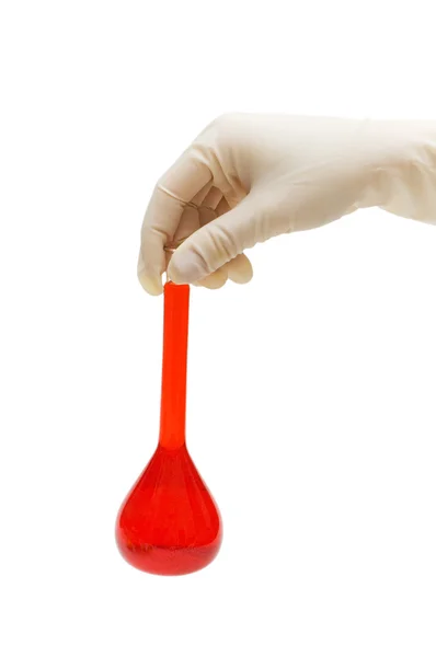Hand som håller röd tub isolerade — Stockfoto