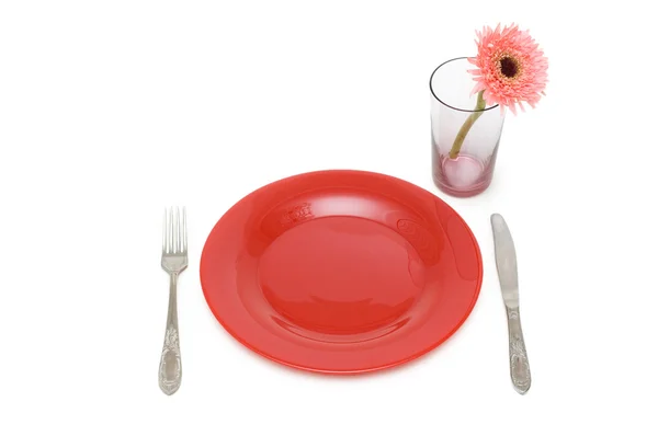 Red plate and table utensils — Stock Photo, Image