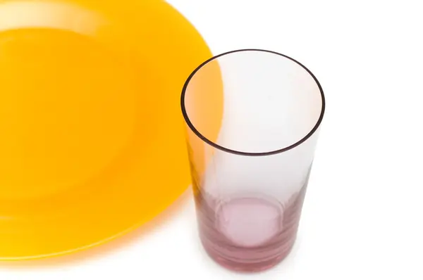 Yellow plate and glass isolated — Stock Photo, Image