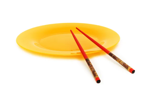 Yellow plate and chopsticks — Stock Photo, Image