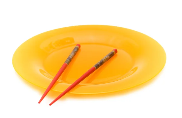 Yellow plate and chopsticks — Stock Photo, Image