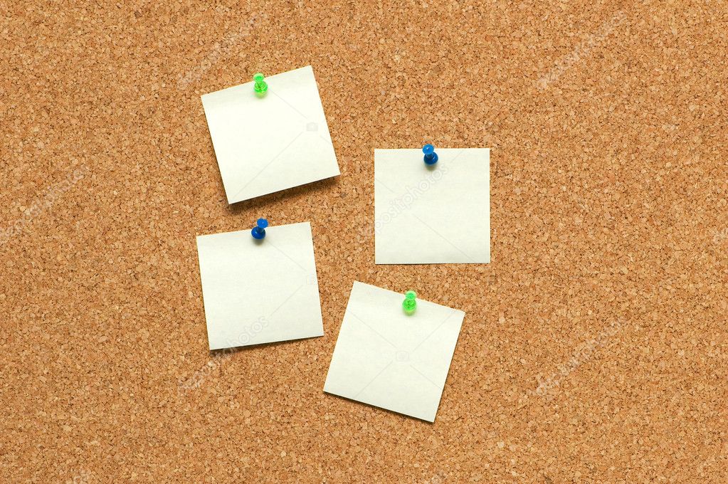 Yellow post it notes on the corkboard