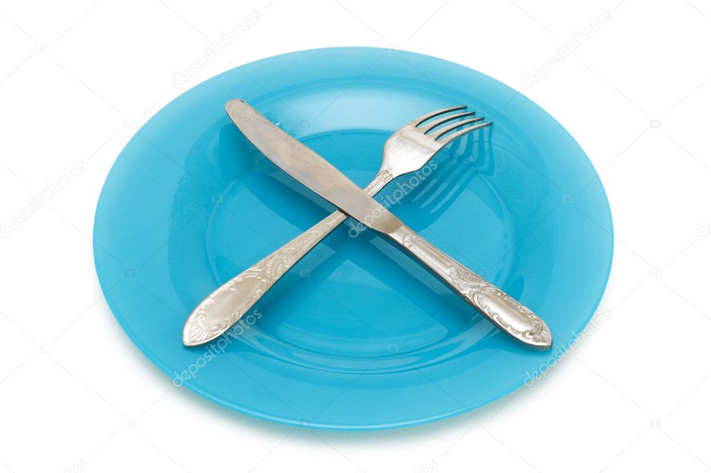 Blue plate with utensils isolated