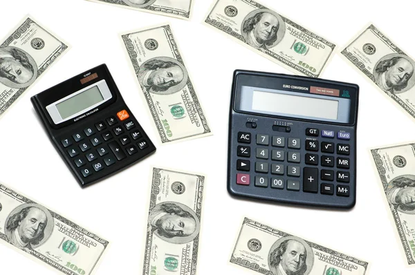 Dólares e calculadoras isolados — Fotografia de Stock