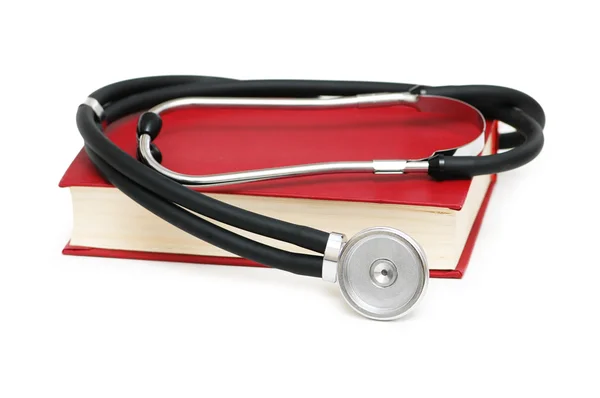 Stetoskop izole kırmızı kitap — Stok fotoğraf