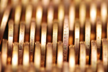 Close up of gold coins in rows clipart