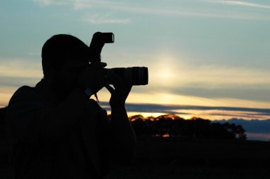 Silhouette of a photographer clipart