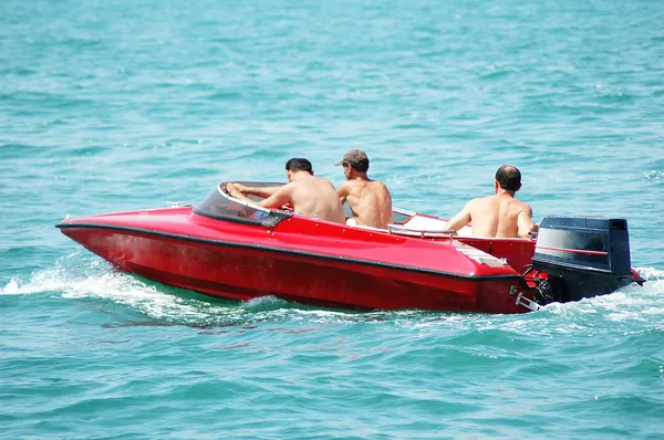 Three on board of motor boat — Stock Photo, Image