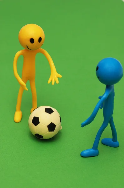 Two smilies playing football — Stock Photo, Image