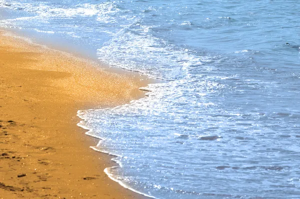 Voda a písek na pláži — Stock fotografie