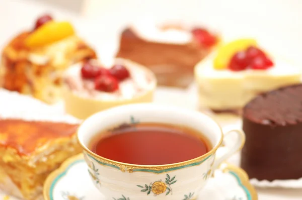 Selection of sweet cakes and tea — Stock Photo, Image