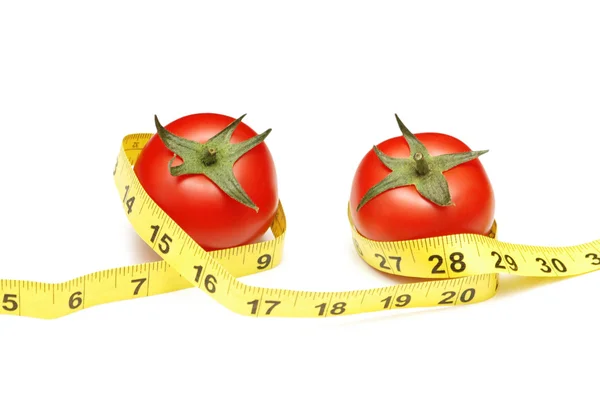 Pomidory i taśma pomiarowa — Zdjęcie stockowe