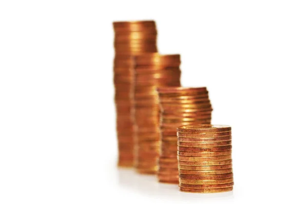 Pilhas de moedas isoladas no branco — Fotografia de Stock