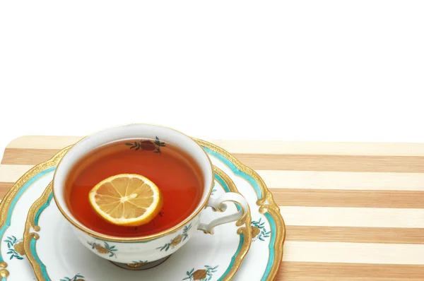 Kopp te med citron isolerade — Stockfoto
