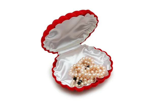 Red peal-shaped box with pearl beads — Stock Photo, Image