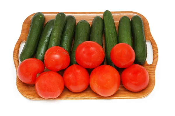 Огірки та помідори ізольовані — стокове фото