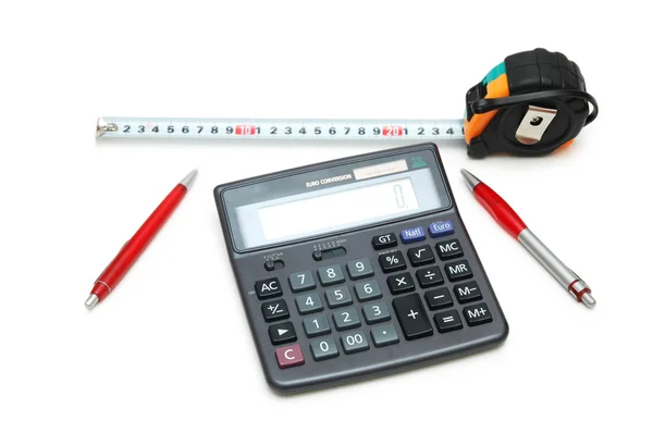 Calculadora, fita métrica e canetas — Fotografia de Stock