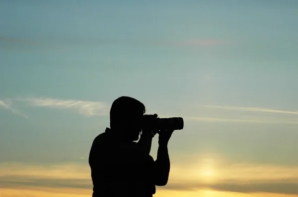 Silhouet van een fotograaf — Stockfoto