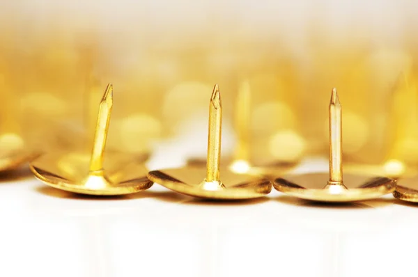 stock image Golden pins isolated on the white