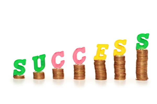 Palabra "éxito" en la parte superior de las monedas —  Fotos de Stock