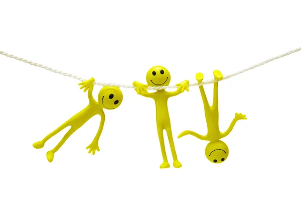 Three smiley actobats on the rope — Stock Photo, Image