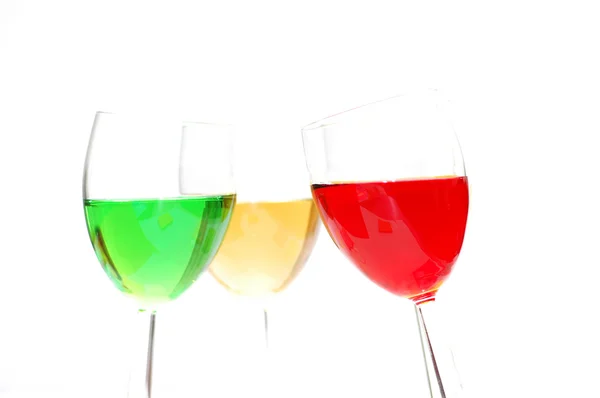 Tre liquori colorati isolati su bianco — Foto Stock