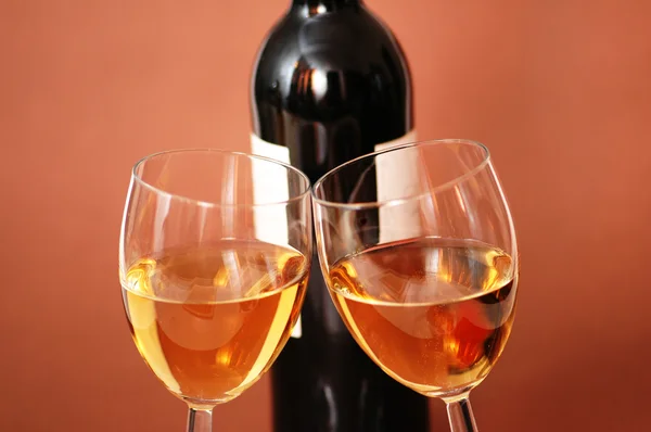 Two wine glasses and bottle of wine — Stock Photo, Image