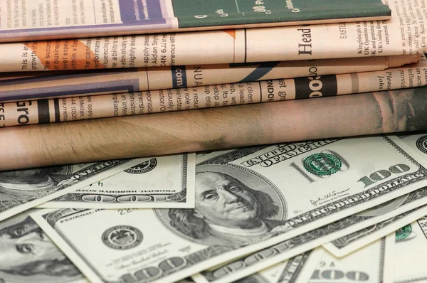 stock image Hundred dollar bank notes and newspaper