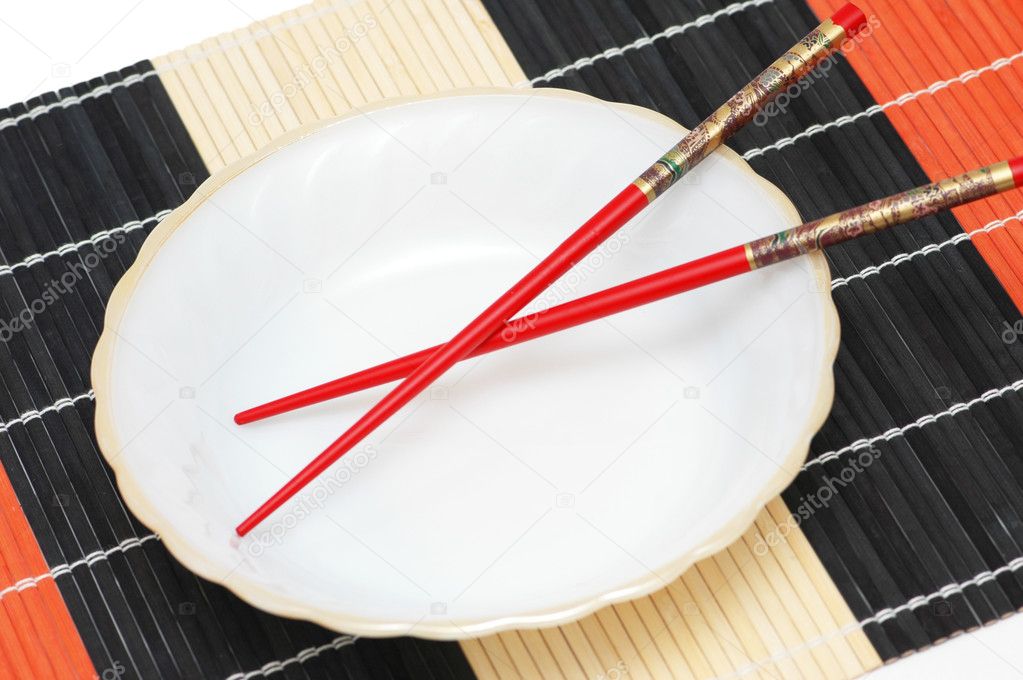 Bown and red chopsticks on mat