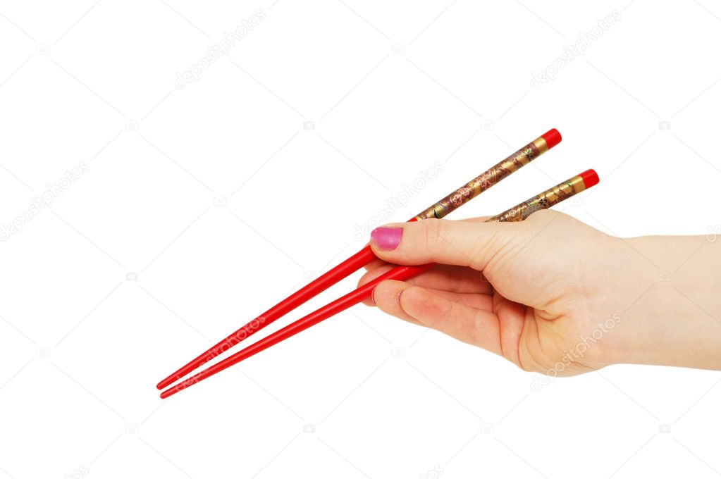 Hand with chopsticks isolated
