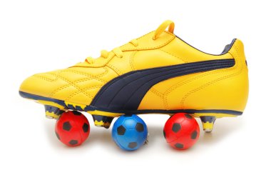 Yellow soccer footwear and footballs clipart