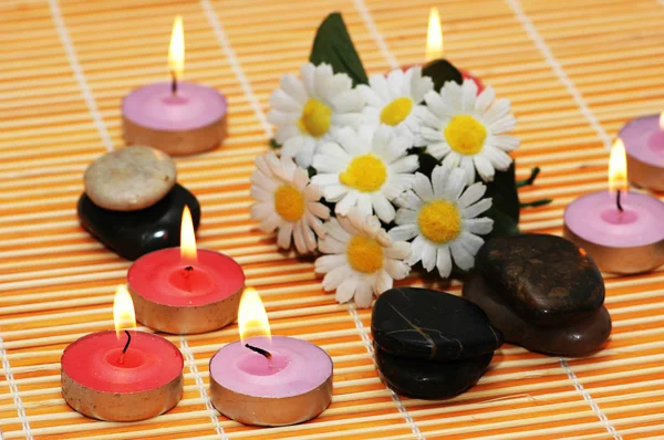 Flowers, stones and candles — Stock Photo, Image