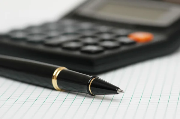 Pen and calculator — Stok fotoğraf