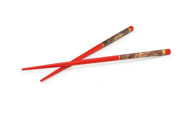Red chopsticks isolated on the white — Stock Photo, Image
