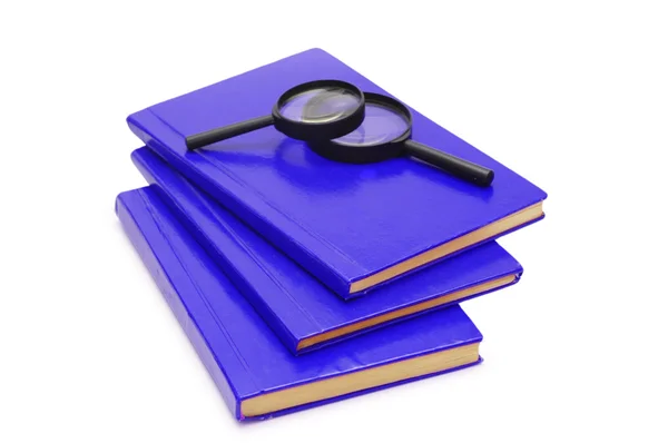 Three books and magnifying glasses — Stock Photo, Image