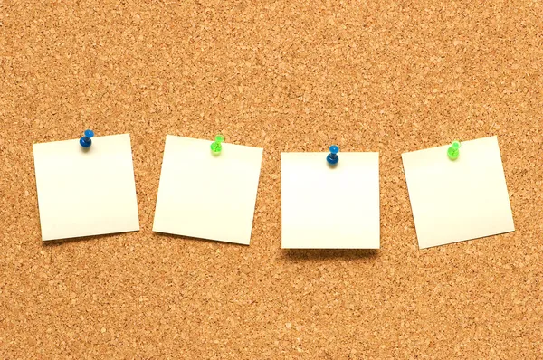 Yellow post it notes on the corkboard — Stock Photo, Image