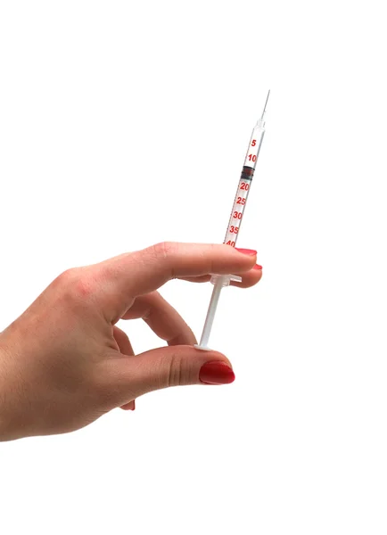 Ruka držící injekční stříkačky, samostatný — Stock fotografie