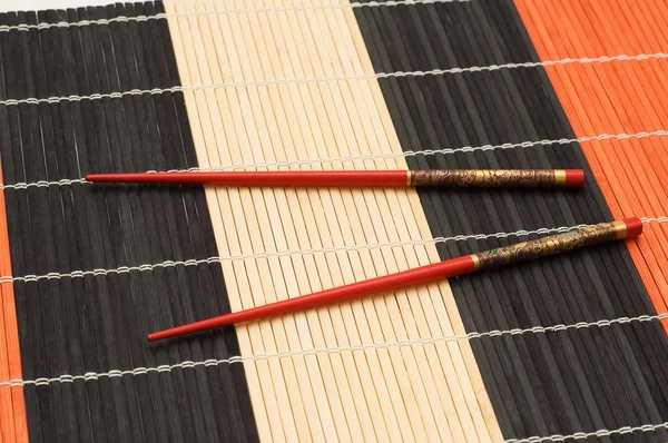 Червоні палички на килимку ізольовані — стокове фото