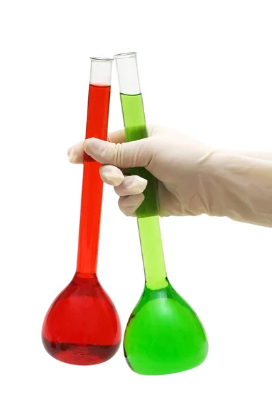 Mão segurando tubos vermelhos e verdes — Fotografia de Stock