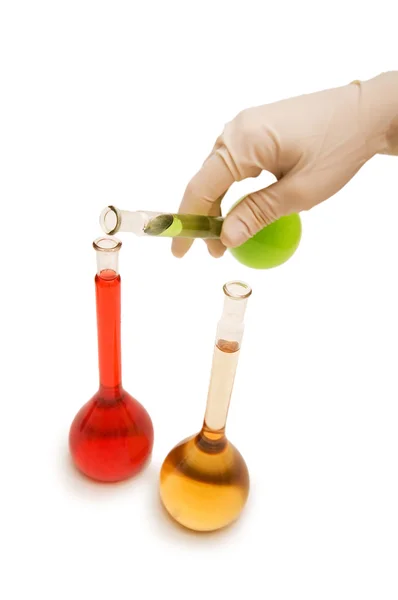 Mão com tubos vermelhos e verdes isolados — Fotografia de Stock