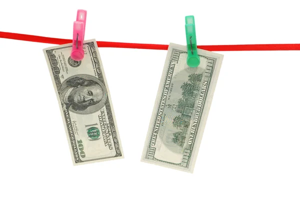 Billetes de dólar colgando de la cuerda — Foto de Stock