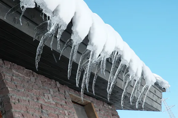 Row of icicles on a bright day — Stock Photo, Image