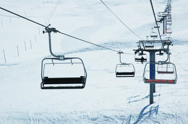 Ski lift chairs on bright day — Stock Photo, Image