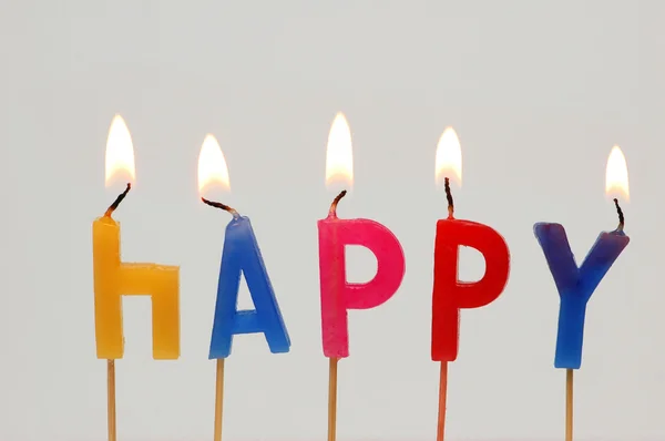 Brennende Kerzen - "glücklich" — Stockfoto