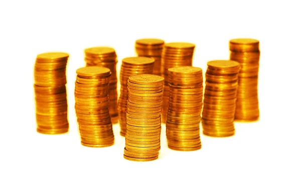 Pilhas de moedas de ouro isoladas — Fotografia de Stock