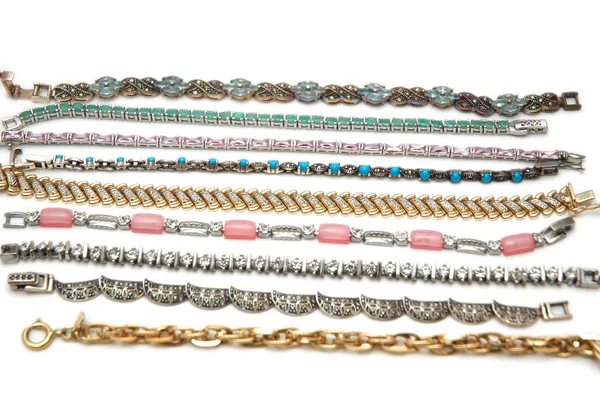 Various bracelets isolated on the white — Stock Photo, Image