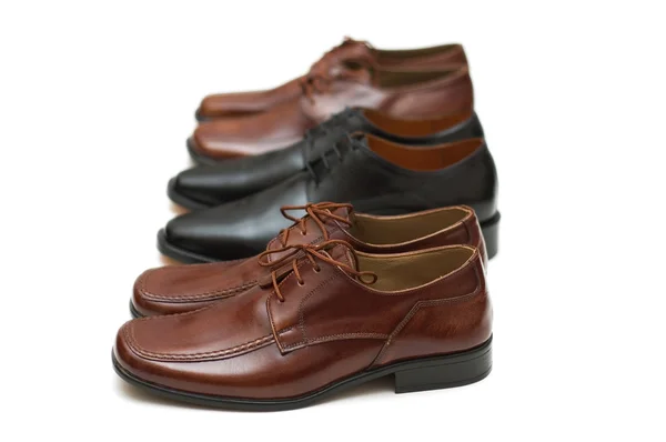 Three pairs of male shoes isolated Royalty Free Stock Photos