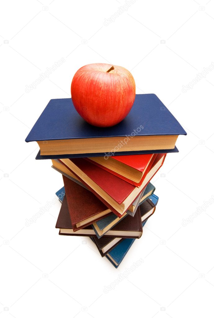 Red apple on top of the book stack