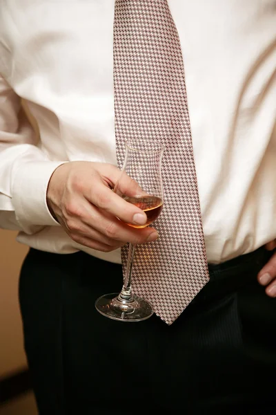 stock image Man holds a glass