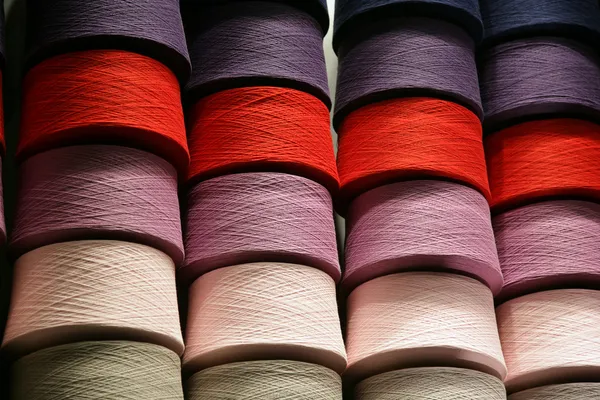 Bobbins with the coloured threads — Stock Photo, Image